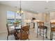 Kitchen breakfast nook with glass-top table and chairs at 206 Clovis Pass, Winter Haven, FL 33880