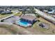 Community pool, tennis courts, playground, and parking area at 206 Clovis Pass, Winter Haven, FL 33880