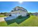 Two-story house showcasing a two-car garage and neatly manicured lawn at 206 Clovis Pass, Winter Haven, FL 33880
