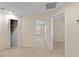 Upstairs hallway with access to bedrooms and bathroom at 206 Clovis Pass, Winter Haven, FL 33880