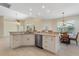 Open kitchen with island and breakfast nook at 206 Clovis Pass, Winter Haven, FL 33880