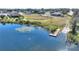 Community lake access with a wooden dock at 206 Clovis Pass, Winter Haven, FL 33880