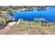 Private boat dock on a serene lake with lush vegetation at 206 Clovis Pass, Winter Haven, FL 33880