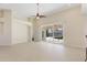 Bright living room with pool view and sliding glass doors at 206 Clovis Pass, Winter Haven, FL 33880