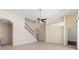 Spacious living room with high ceilings and a view of the staircase at 206 Clovis Pass, Winter Haven, FL 33880