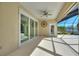 Covered patio with sliding glass doors at 206 Clovis Pass, Winter Haven, FL 33880