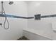 Modern shower with marble bench and mosaic accents at 206 Clovis Pass, Winter Haven, FL 33880