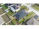 Aerial view of a single Gathering home with a dark roof and a large, fenced-in backyard at 1109 Brenton Manor Dr, Winter Haven, FL 33881