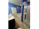 Bright bathroom with double sinks, shower with glass door, and a separate tub at 1109 Brenton Manor Dr, Winter Haven, FL 33881