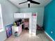Fun bedroom with a loft bed, desk, and playful decor at 1109 Brenton Manor Dr, Winter Haven, FL 33881