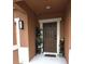 Inviting front porch with decorative planters and a 'welcome' mat at the front door at 1109 Brenton Manor Dr, Winter Haven, FL 33881