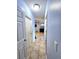 Hallway boasts tile floors and access to multiple rooms in the home at 1109 Brenton Manor Dr, Winter Haven, FL 33881