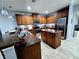 Modern kitchen featuring granite countertops, stainless steel appliances, and ample storage space at 1109 Brenton Manor Dr, Winter Haven, FL 33881
