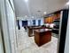 Bright kitchen with stainless steel appliances and granite counters with an island at 1109 Brenton Manor Dr, Winter Haven, FL 33881