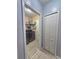 Laundry room with washer, dryer, shelving and access to additional storage at 1109 Brenton Manor Dr, Winter Haven, FL 33881