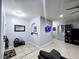 A living room with ceramic tile flooring and open floor plan at 1109 Brenton Manor Dr, Winter Haven, FL 33881