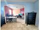 Office with two built-in desks, wood flooring, and blue accent wall at 1109 Brenton Manor Dr, Winter Haven, FL 33881