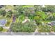 Overhead view shows lush trees surrounding a cozy home nestled in a residential area at 1705 Davis Ave, Bartow, FL 33830