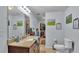 Bathroom featuring a large vanity mirror, granite countertops and closet at 1705 Davis Ave, Bartow, FL 33830