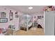 Pink bedroom with canopy bed, soft carpet, and shelves for decor at 1705 Davis Ave, Bartow, FL 33830