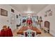 Bright dining room with long wooden table, fireplace, and ample seating for large gatherings at 1705 Davis Ave, Bartow, FL 33830