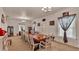 Large dining room with a long wooden table, multiple chairs, and natural light from the window at 1705 Davis Ave, Bartow, FL 33830