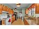 Spacious kitchen with ample counter space, wooden cabinets, and standard appliances at 1705 Davis Ave, Bartow, FL 33830