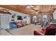 Inviting living room with wood-paneled ceilings, a TV, and comfortable seating arrangement at 1705 Davis Ave, Bartow, FL 33830