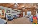 Spacious living room with wood ceilings, comfortable seating, and rustic decor at 1705 Davis Ave, Bartow, FL 33830