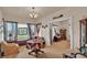 Bright living room with a stained glass window, wooden furniture, and an open layout at 1705 Davis Ave, Bartow, FL 33830