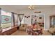 Charming living room featuring a stained glass window and a colorful quilt table at 1705 Davis Ave, Bartow, FL 33830