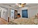 Bedroom with closet featuring sliding barn door and an ensuite bathroom at 1705 Davis Ave, Bartow, FL 33830