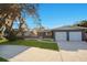 Charming single Gathering home with a well-manicured lawn, mature trees and a two car garage at 1865 15Th Nw Ct, Winter Haven, FL 33881