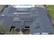 Aerial view of roof with solar panels on top of roof, including a glimpse of pool at 1865 15Th Nw Ct, Winter Haven, FL 33881