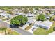 Aerial view of the home showing the driveway and neighborhood at 511 Alcazar Ct, The Villages, FL 32159