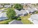 Aerial view of home with lawn and trees in the neighborhood at 511 Alcazar Ct, The Villages, FL 32159