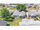 Aerial view of the home, showcasing its roof, lawn, and the surrounding neighborhood at 511 Alcazar Ct, The Villages, FL 32159