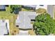 Aerial view of the home showing roof, driveway, and landscaping at 511 Alcazar Ct, The Villages, FL 32159
