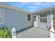 Backyard patio with siding and a white door at 511 Alcazar Ct, The Villages, FL 32159