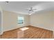 Bright bedroom with a window, ceiling fan and wood floors for a relaxing retreat at 511 Alcazar Ct, The Villages, FL 32159