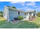 View of the side of the home with an AC unit at 511 Alcazar Ct, The Villages, FL 32159
