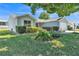 Charming single-story home featuring well-manicured landscaping and an attached two-car garage at 511 Alcazar Ct, The Villages, FL 32159