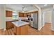 Well-equipped kitchen features stainless steel appliances and a functional center island at 511 Alcazar Ct, The Villages, FL 32159