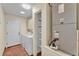 Laundry room with washer, dryer, and storage shelves at 511 Alcazar Ct, The Villages, FL 32159
