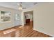 Living room with hardwood floors and view of the kitchen at 511 Alcazar Ct, The Villages, FL 32159