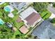 Aerial view of a home highlighting a spacious backyard, including a detached garage, and an in-ground pool at 1819 Meadowbrook Ave, Lakeland, FL 33803