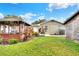 Landscaped backyard features a screened gazebo and offers outdoor relaxation at 1819 Meadowbrook Ave, Lakeland, FL 33803