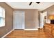 Neutral bedroom with hardwood floors, closet and modern ceiling fan at 1819 Meadowbrook Ave, Lakeland, FL 33803