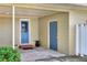 Carport with blue doors and steps at 1819 Meadowbrook Ave, Lakeland, FL 33803