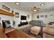 Spacious living room with fireplace, TV, comfortable seating, and stylish decor at 1819 Meadowbrook Ave, Lakeland, FL 33803